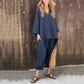 Zweiteiliges Set aus Oberteilen und Hosen mit einfarbigem High-Low-Saum